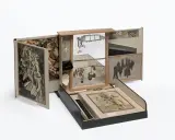 A surreal assemblage of famous drawers, featuring collage, mirrors, and found objects, creating a miniature world of artistic exploration.