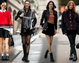 Moda invernale: outfit con gonna nera corta, giacche in pelle e stivali.