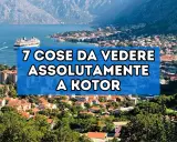 Panoramica del centro storico di Kotor, con un grande transatlantico nel golfo e montagne sullo sfondo.
