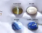 Sześć kamieni szlachetnych: kocie oko, perła, ametyst, agat, lapis lazuli, tygrysie oko, na białym tle.