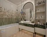 Elegancka łazienka z wanną, nad którą widać płytki z motywem liści. Czy pod wanną kładzie się płytki? Tak, widać je na ścianie.