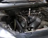Silnik Astry J 1.4 turbo z widocznym rozrządem. Objawy awarii pompy wody mogą być różne, warto sprawdzić stan elementów.