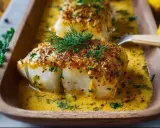 Zartes Fischfilet mit knuspriger Kruste in cremiger Sauce, ein köstliches Fischauflauf Rezept.