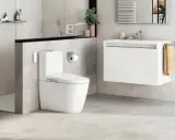 Modern bathroom with toilet and sink. A sleek design that makes you want to quitar bidet.