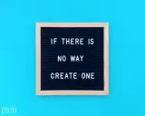 Czarna tablica z białym napisem "IF THERE IS NO WAY CREATE ONE" na niebieskim tle.