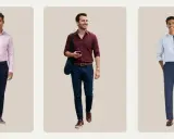 Three men in navy pants. One wears a pink dress shirt, another a burgundy shirt, and the third a light blue shirt.