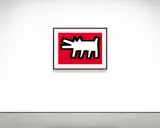 A white, stylized Keith Haring barking dog with black outlines on a vibrant red background, framed in black.