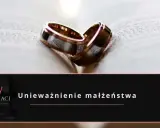 Dwa obrączki na otwartej księdze symbolizują rozważania o **unieważnieniu małżeństwa**.