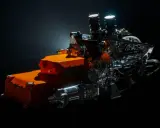 Un vistazo a los futuros motores F1 2026: un complejo sistema híbrido con componentes naranjas y metálicos, listo para la velocidad.