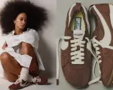 Kobieta z burzą włosów w białej koszuli i brązowe buty Nike Cortez x Jacquemus, które mogą być jej pierwsze buty Nike.