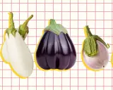 A colorful display of various types of eggplant, from white to deep purple, arranged on a grid background.