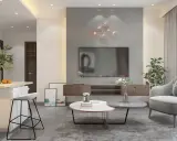 Soggiorno moderno con divano grigio, tavolini rotondi e decorazioni floreali. I colori da abbinare al grigio perla includono tocchi di verde e arancio.