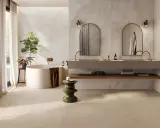 Baño moderno con bañera exenta, lavabos dobles y azulejos a matajunta en paredes y suelo.
