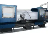 Tornio CNC MCM Neos, con mandrino e pannello di controllo digitale.