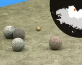 Terrain de jeu pour la boule bretonne, avec des boules de différentes matières et couleurs. Une carte de la Bretagne est visible en arrière-plan.