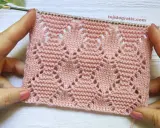 Muestra de tejido rosa con rombos a dos agujas patrones calados, ideal para prendas delicadas.