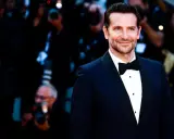 Bradley Cooper smiles, sporting a classic tuxedo. This image confirms that black tie does indeed mean tuxedo.