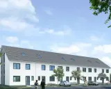 Nowoczesne domy w zabudowie szeregowej z szarym dachem i białymi fasadami, otoczone zielenią.