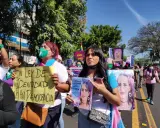 Protesters in El Salvador hold signs demanding identity rights and justice. One sign reads "Without identity law, there is no democracy.