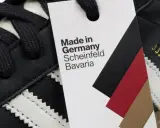 Metka na czarnym bucie adidas informuje: Made in Germany, Scheinfeld, Bavaria.
