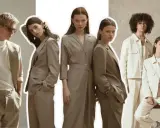 Models showcase gender fluid fashion in neutral-toned suits and jackets, blurring traditional style lines.