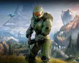 Master Chief w zbroi z Halo Infinite stoi na tle górskiego krajobrazu z pierścieniem Halo i pojazdem UNSC.