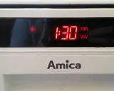 Wyświetlacz zmywarki Amica pokazuje błąd EC. Czerwone cyfry "1:30" i symbol płatka śniegu sugerują problem z temperaturą lub zamarzaniem.