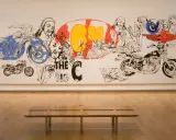 Andy Warhol's "The Last Supper" reimagined with motorcycles and bold graphics, a vibrant commentary on faith and consumerism.