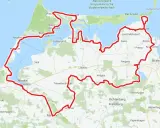 Mapa z zaznaczonymi trasami rowerowymi w Niemczech, wiodącymi przez malownicze wybrzeże i park narodowy.
