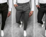 Trzy pary męskich spodni: gładkie ciemne, w pionowe paski szare i czarne. To są chinosy, idealne na co dzień i do eleganckich stylizacji.