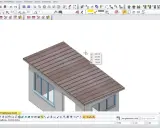Projektowanie dachu jednospadowego w programie CAD. Widok 3D budynku z zaznaczonym dachem.