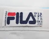 Oryginalna metka Fila z napisem "MADE IN ITALY" i rozmiarem J 3XL.