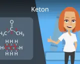 Chemische Formel für Keton (Aceton) mit nummerierten Kohlenstoffatomen. Eine lächelnde Frau gibt Daumen hoch.