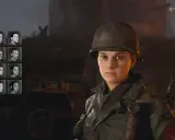 Wybór twarzy żołnierza w grze Call of Duty 2. Widoczna postać w hełmie, obok miniatur innych postaci.