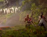 Aloy i jej towarzyszka przemierzają bujną dżunglę w Horizon Forbidden West: Burning Shores, mijając zniszczony napis Hollywood.