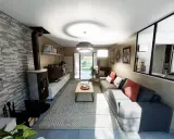 Plan aménagement salon en longueur : canapé d'angle gris, poêle à bois, mur en pierre, table basse et tapis géométrique.