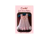 Patrones de vestidos de ganchillo y tela para niña. Un vestido rosa pálido con corpiño de ganchillo y falda de gasa, adornado con flores y lazos.