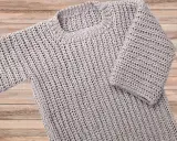Jersey de punto gris con un diseño de patrón de punto grueso, ideal para un patrón jersey.