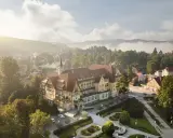 Sanatorium Polonia w Kudowie Zdroju, z pięknymi pokojami i otoczeniem, w mglisty poranek.