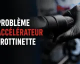 Main noire tenant la poignée d'une trottinette électrique, texte "Problème accélérateur trottinette".