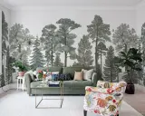 Mural w mieszkaniu z motywem lasu, zielona sofa i kolorowy fotel tworzą przytulną przestrzeń.