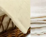 A close-up of a light-colored, woven muslin cotton fabric. The left side shows the fabric draped over a wicker basket, with text overlay. The right side displays a stack of folded muslin cotton.