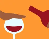 En hand stoppar ett glas rött vin medan en flaska hälls. Kanske en påminnelse om att vara försiktig med alkohol, särskilt om man tar medicin som Diamox.