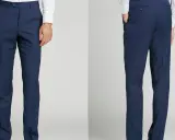 Front and back views of navy blue dress pants. These pants are tailored for a clean look, demonstrating the unhemmed pants meaning of a raw edge ready for custom fitting.