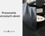Jak wyprasować skórę? Czarna skórzana kurtka na wieszaku, obok parownica Steamaster.