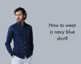 Man in a navy blue shirt and white pants, asking "How to wear a navy blue shirt?".