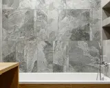 Schemi posa piastrelle 60x120 bagno: un elegante rivestimento in gres effetto marmo grigio crea un'atmosfera moderna e rilassante.