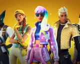 Pięć postaci z Fortnite, w tym kot-samuraj i dziewczyna z tęczowymi włosami. Szukasz **fortnite kody na skiny**?
