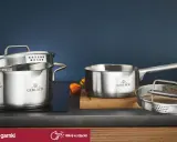 Stalowe garnki Gerlach na płycie indukcyjnej. Czy garnki można myć w zmywarce? Tak, te są łatwe w czyszczeniu.