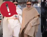 Due donne eleganti mostrano come indossare una mantella con stile, una in crema e l'altra in cammello.
